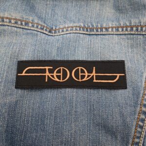 Tool Logo Patch (Geometric Script Design) – Iron-On